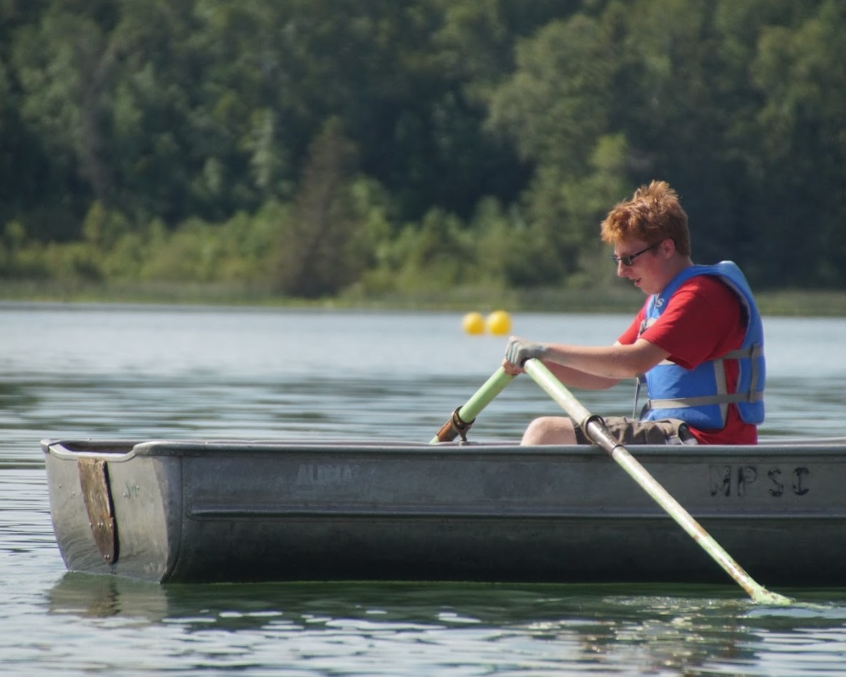 A Scout is rowing in the lake